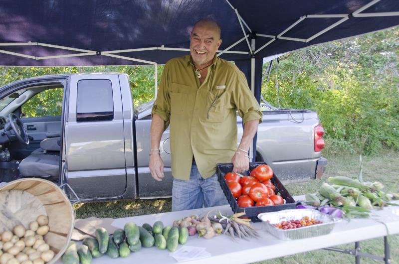 Gary Rago of Org Gardens sells his produce on North Street in Mattapoisett at Wyandotte Wednesdays. BY GEORGIA SPARLING